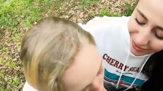 Two Girlfriends Suck Cock in the Wood