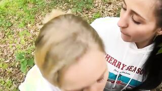 Two Girlfriends Suck Cock in the Wood