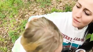 Two Girlfriends Suck Cock in the Wood