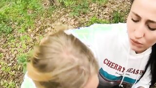 Two Girlfriends Suck Cock in the Wood