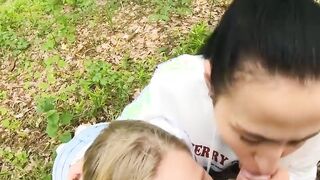Two Girlfriends Suck Cock in the Wood