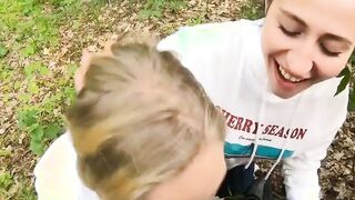 Two Girlfriends Suck Cock in the Wood