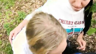 Two Girlfriends Suck Cock in the Wood