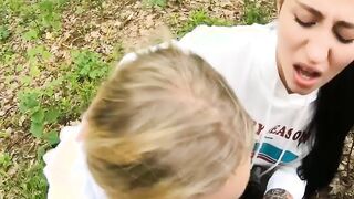 Two Girlfriends Suck Cock in the Wood