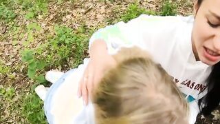 Two Girlfriends Suck Cock in the Wood