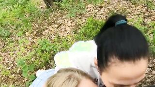 Two Girlfriends Suck Cock in the Wood