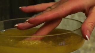 Blonde Beauty pours honey on her super body as she masturbates