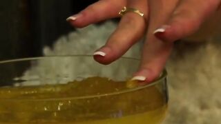 Blonde Beauty pours honey on her super body as she masturbates