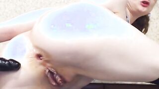 Stepmom into pantyhose uses a black sex sex toy