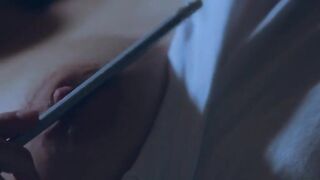 Rubbing her huge puffy nipples as she fucks herself with a pencil