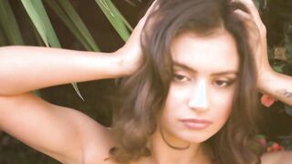 Asian babe reveals her big boobs outdoor