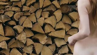Redhead Russian naked babe chopping wood