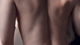 An intense doggy-style encounter with a girl wearing black stockings, her oiled-up as