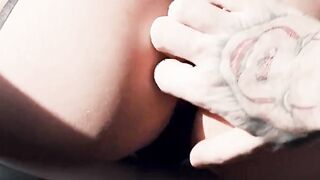 An intense doggy-style encounter with a girl wearing black stockings, her oiled-up as