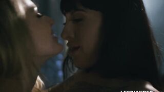 Dyke blonde licks the tattooed snatch of a long boobed dark haired