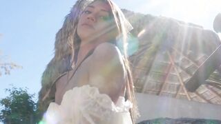Petite naked exotic muse posing outdoor