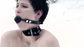 Naked barefoot Claudia chained in the snow