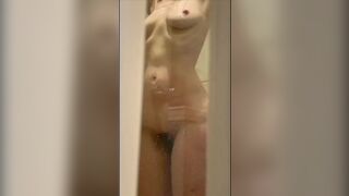 Wife's wet body through the shower door.