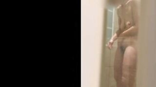 Wife's wet body through the shower door.