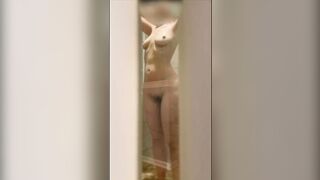 Wife's wet body through the shower door.