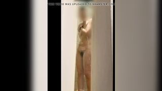 Wife's wet body through the shower door.