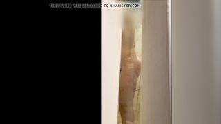 Wife's wet body through the shower door.