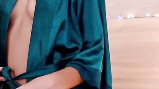 Petite Latina rides dildo in bed on webcam