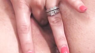 busty milf gets nude on couch and toys pussy with vibrator
