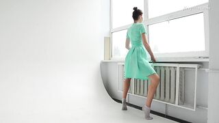 Dressed flexible dark haired Alla Sinichka