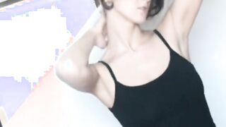 Dark Hair pleasuring her wet vagina on a mat