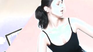 Dark Hair pleasuring her wet vagina on a mat