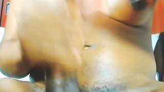 Big tits ebony TS peeing on herself on webcam