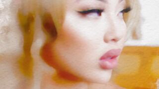 Blonde Asian MILF exposes her big curves