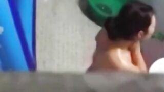 Asian stepdaughter spied in the bathhouse