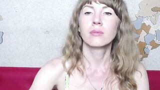 Ukrainian MILF fondles shaved pussy on webcam