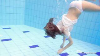 Big jugs dark haired Cutie Zuzanna swimming into the pool