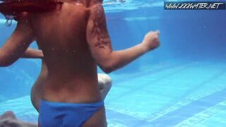 two Hot lesbian brunettes in the swimming pool
