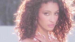 Curly hair latina posing in lingerie