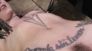 Redhead bound in a bridge position whipped