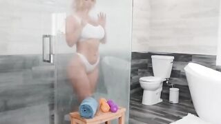 Blonde with big milkings right in the bathroom has fun with a black man and cums