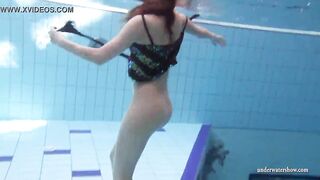 Zuzanna swims naked and horny inside the pool