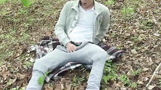 Inked european jock rubbing his foot and penis into the woods