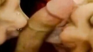 Two girls suck one cock
