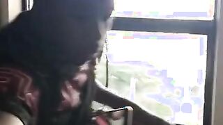 Young black guy doggystyle standing at the window