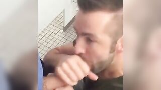 Hunk gives blowjob in a public restroom - amateur gay porn