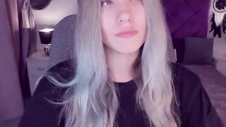 Blonde teen smoking and stripping off