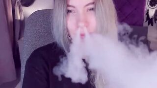 Blonde teen smoking and stripping off