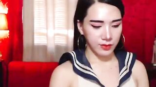 Asian shemale schoolgirl jerks off