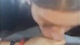 Pierced Brunette Blows in the Car