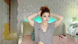 Russian Girl caresses herself on the camera and plays